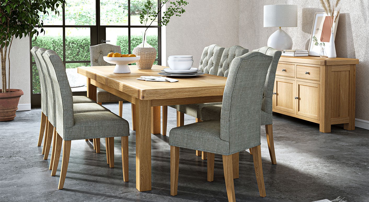 navarre solid oak dining set in a neutral dining room featuring the matching navarre sideboard