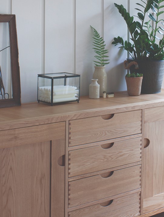 Ercol Bosco Large Oak Sideboard Displaying Plants, Vases and Decor