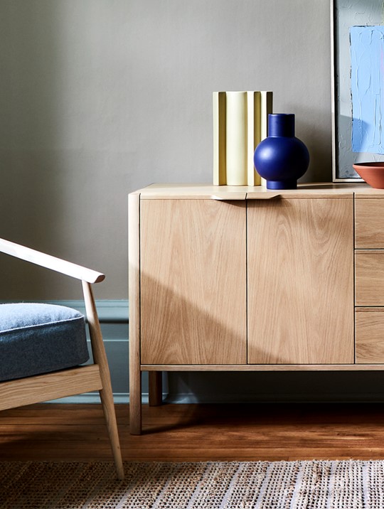 Ercol Aldbury Chair And Oak Sideboard In A Bright Livingroom with Wooden Flooring